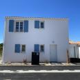 Façade principale d'une maison en accession sociale BRS à Le Brée-les-Bains sur l'Île d'Oléron